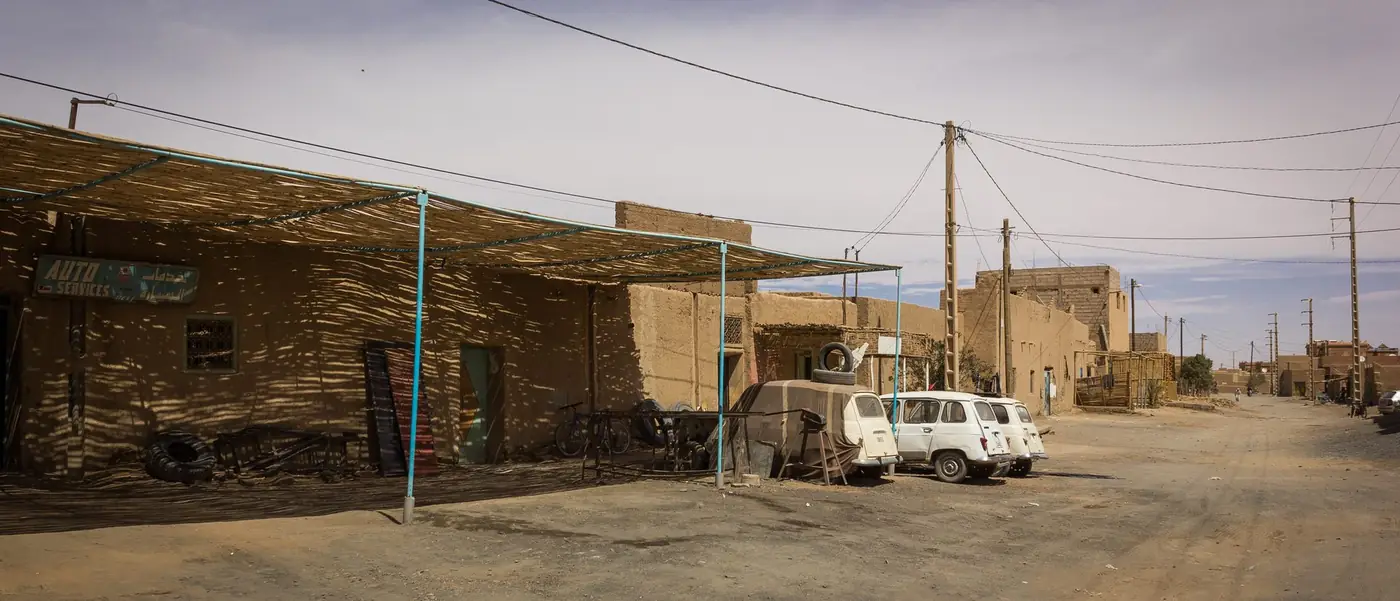 Mechanic workshop in Merzouga with a Toyota pickup under repair
